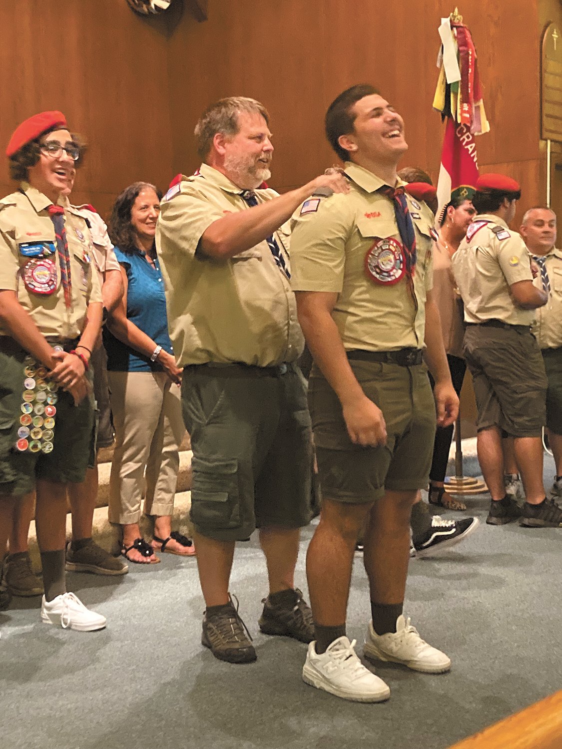 OFFICIALLY DUBBED EAGLE SCOUT: Scout master Jeff Goldthwait dubs Teddy Shackelford an Eagle Scout at the Troop 66 Garden City Eagle Scout ceremony on Aug. 18 at Lakewood Baptist Church. (Herald photo)